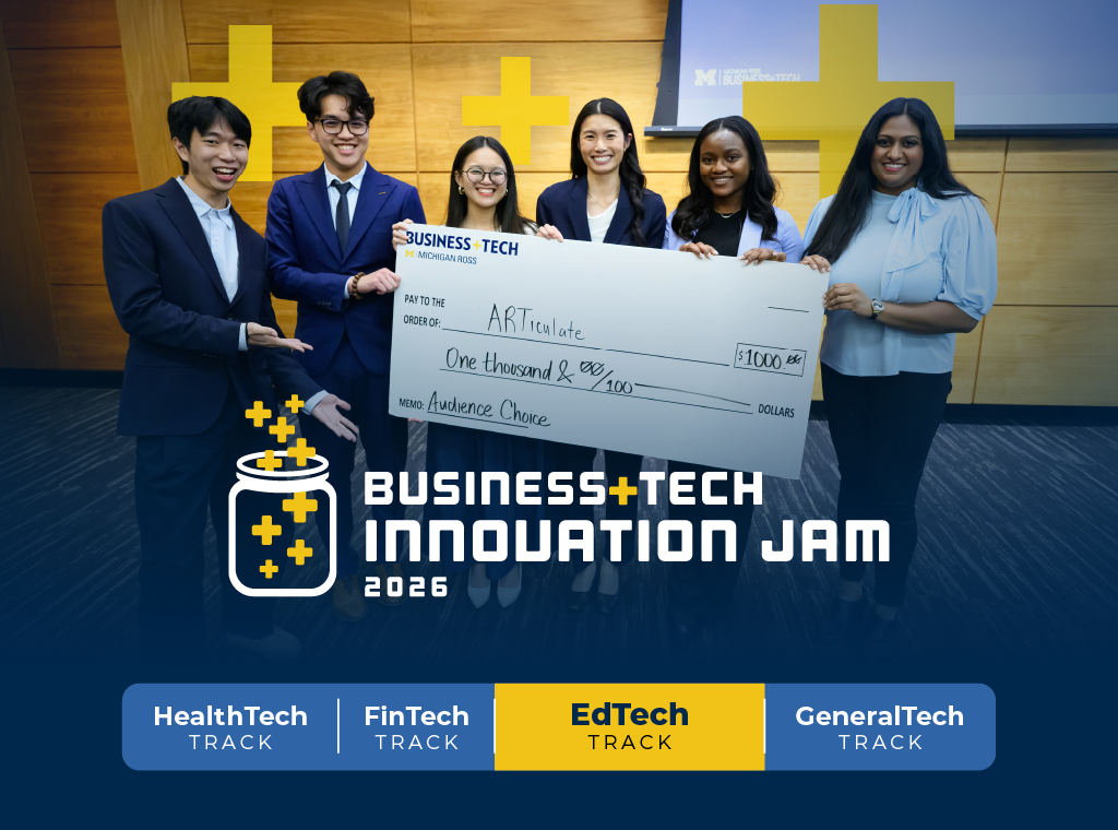 A winning team holding a check at the competition finale