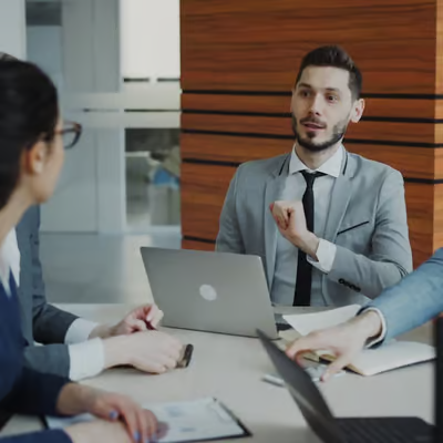 individuals talking at a business meeting